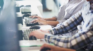 Students Typing at Their Computer