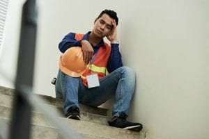 employee resting on the stairs